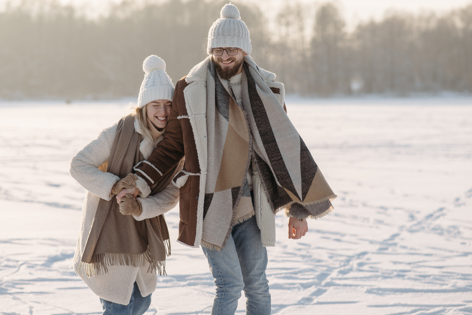Cute Couple on a Snow Covered Ground 